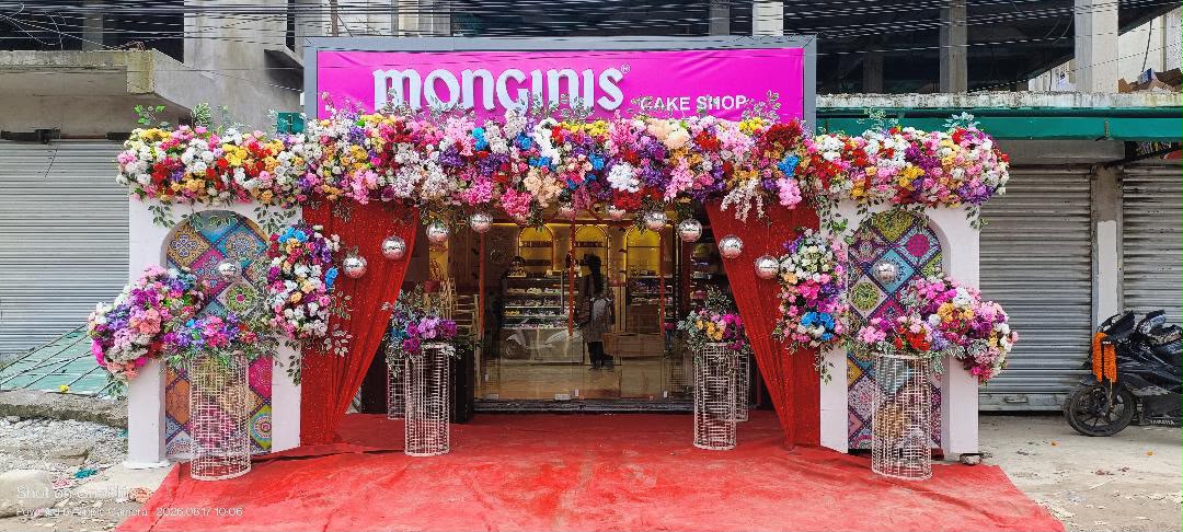 Anushri Cake Heaven Monginis storefront decorated with flowers